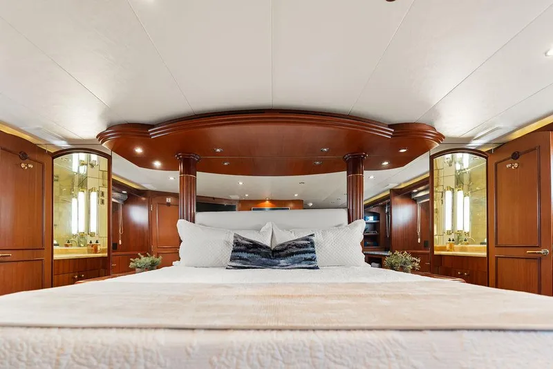 Slide: The Image of Luxurious bedroom interior of 2004 Hatteras 100 Motor Yacht with elegant wood finishes. - 29