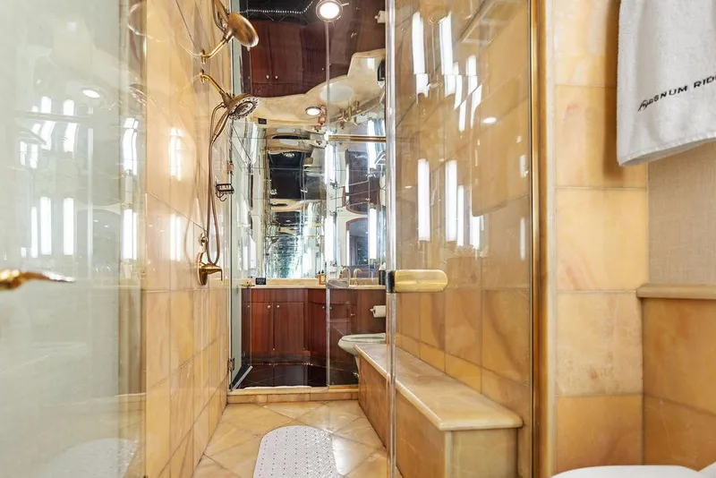 Slide: The Image of Luxurious bathroom in 2004 Hatteras 100 Motor Yacht with glass shower and elegant fixtures. - 32