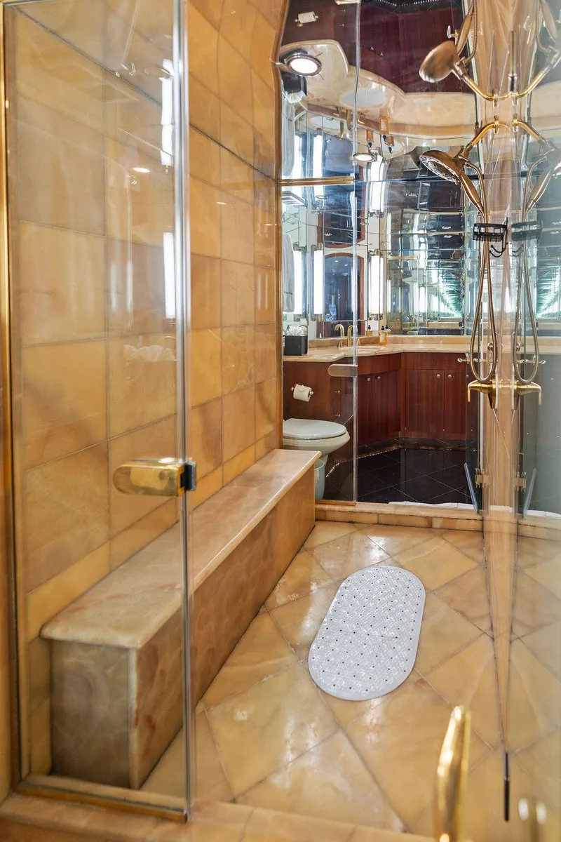 Slide: The Image of Luxurious bathroom in 2004 Hatteras 100 Motor Yacht with glass shower and elegant fixtures. - 34