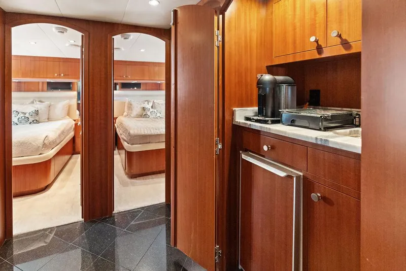 Slide: The Image of Luxurious interior of 2004 Hatteras 100 Motor Yacht with twin bedrooms and kitchenette. - 36