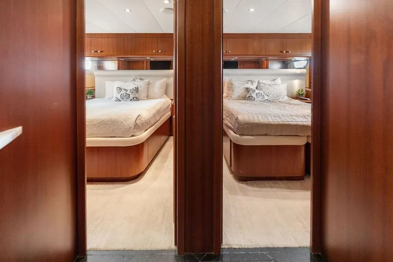 Slide: The Image of Luxurious twin bedrooms on 2004 Hatteras 100 Motor Yacht with elegant wood finishes. - 37