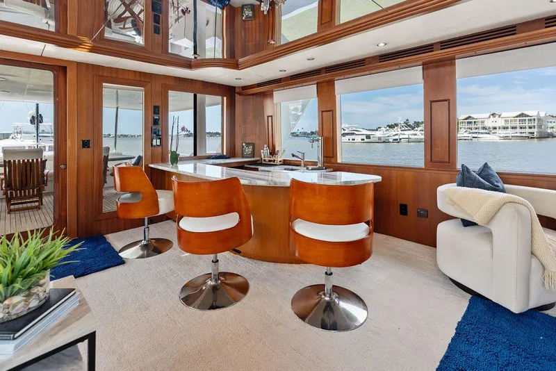 Slide: The Image of Luxurious interior of 2004 Hatteras 100 Motor Yacht with bar and scenic windows. - 7