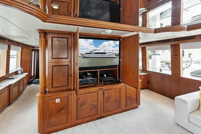 Slide: The Image of Luxurious interior of 2004 Hatteras 100 Motor Yacht with elegant wood cabinetry. - 8