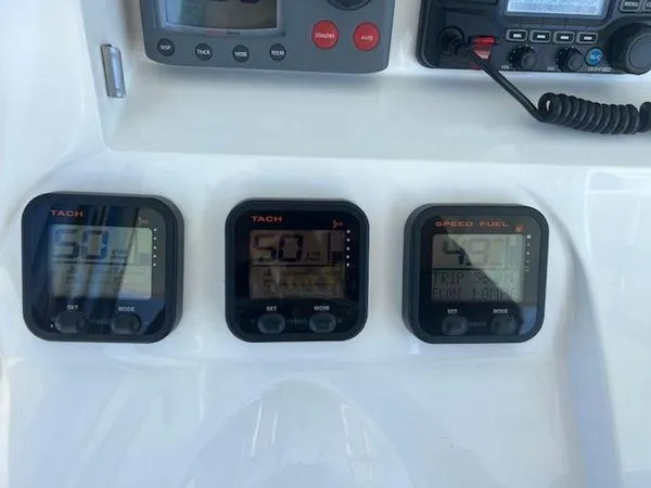 Slide: The Image of Boat dashboard with tachometers and speed fuel gauge, Spectre 34, 2008 model. - 21