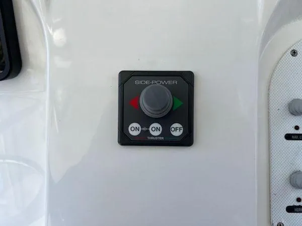 Slide: The Image of Control panel for Side-Power thruster on 2008 Spectre 34 boat. - 25