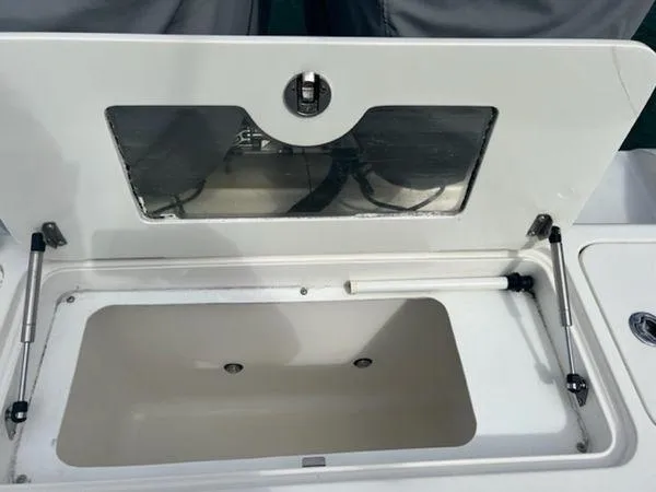 Slide: The Image of Open storage compartment on a 2008 Spectre 34 boat. - 29