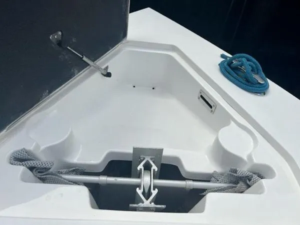 Slide: The Image of Anchor storage compartment on a 2008 Spectre 34 boat with blue rope. - 34