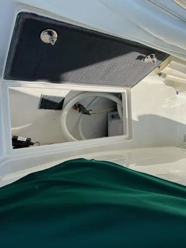 Slide: The Image of Open storage compartment on a 2008 Spectre 34 boat. - 42