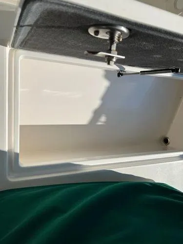 Slide: The Image of Open storage compartment on a 2008 Spectre 34 boat. - 44