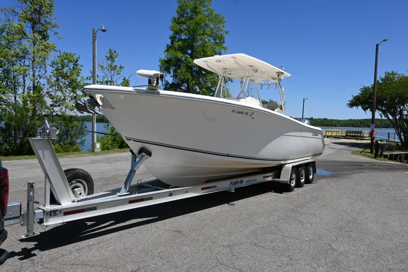 Slide: The Image of Aerial view of 2013 Cobia 296 Center Console boat on water. - 7
