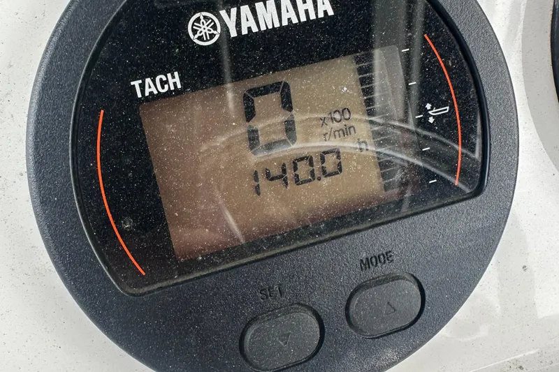 Slide: The Image of Yamaha tachometer display on 2017 Sea Hunt Ultra 234 boat, showing 1400 hours. - 10