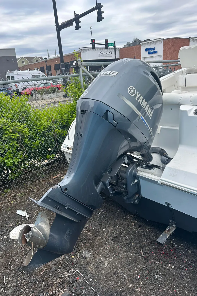 Slide: The Image of 2017 Sea Hunt Ultra 234 with Yamaha outboard motor in urban setting. - 5