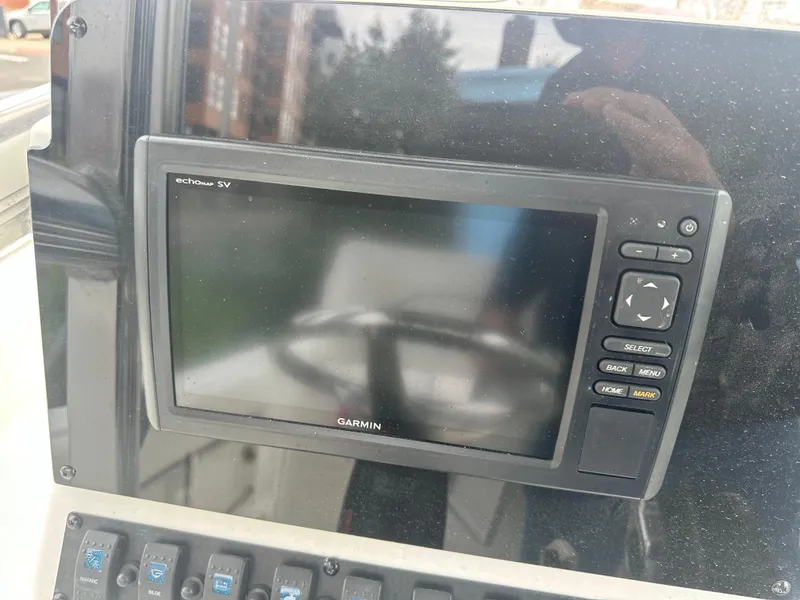 Slide: The Image of Garmin marine GPS system on 2017 Sea Hunt Ultra 234 boat dashboard. - 7