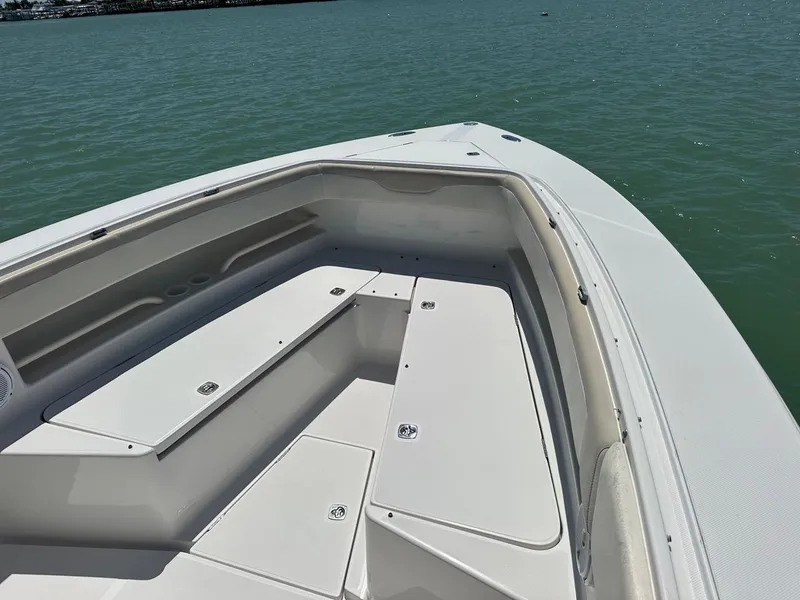 Slide: The Image of 2009 Jupiter 29 FS CC boat deck with seating, on calm water. - 10