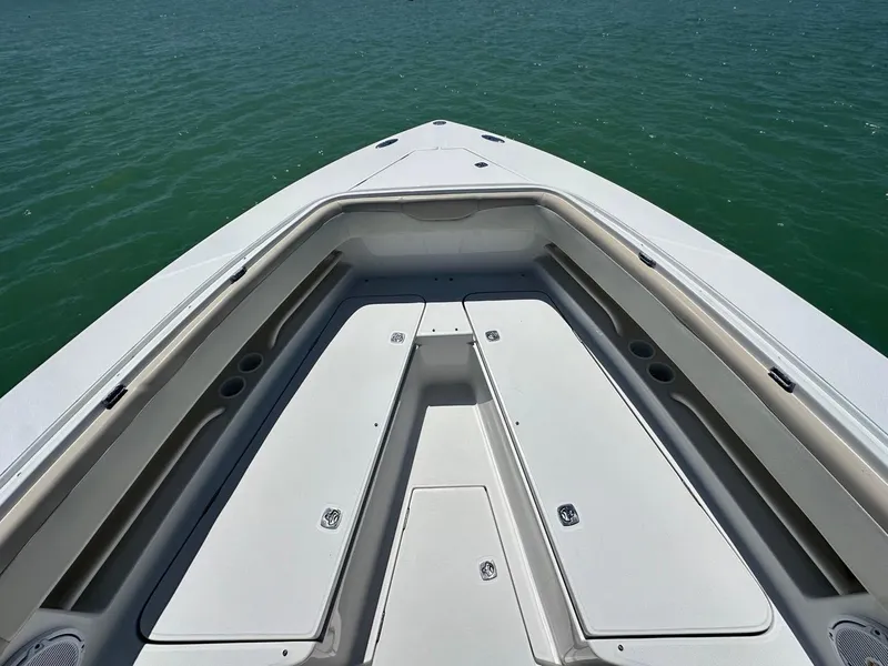 Slide: The Image of 2009 Jupiter 29 FS CC boat deck with storage compartments on calm water. - 11