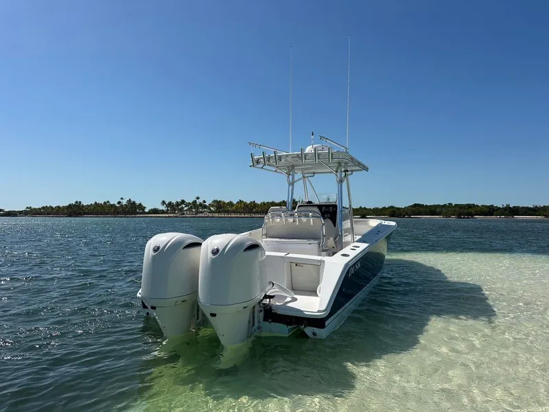 Slide: The Image of 2009 Jupiter 29 FS CC boat with dual engines in shallow, clear water. - 2