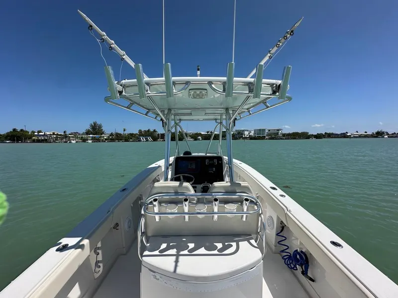 Slide: The Image of 2009 Jupiter 29 FS CC boat on calm water under clear blue sky. - 20