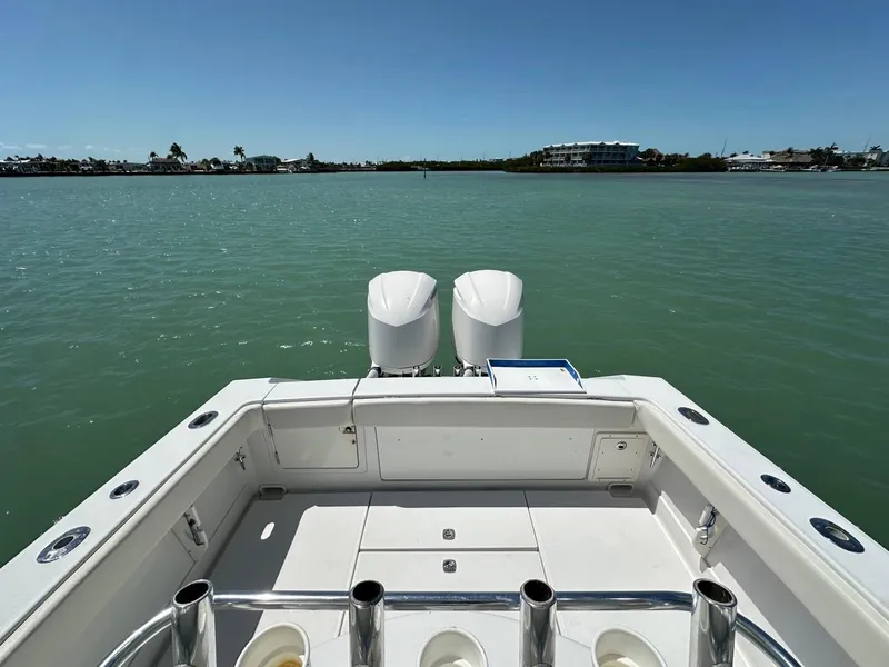 Slide: The Image of 2009 Jupiter 29 FS CC boat with dual engines on calm water. - 21