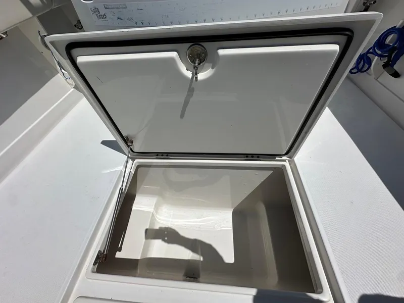 Slide: The Image of Open storage compartment on a 2009 Jupiter 29 FS CC boat. - 24