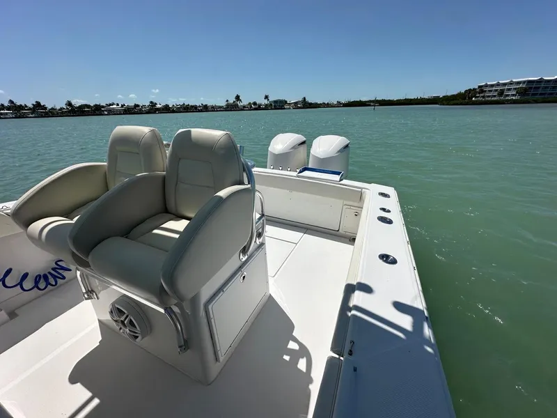 Slide: The Image of 2009 Jupiter 29 FS CC boat with dual engines on calm water. - 25