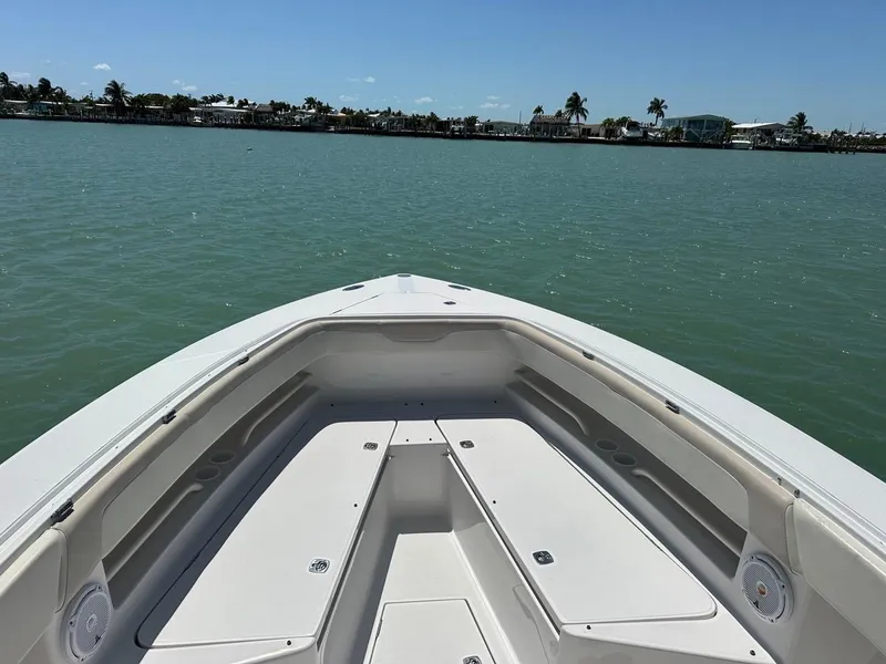 Slide: The Image of Bow view of 2009 Jupiter 29 FS CC boat on calm water. - 7