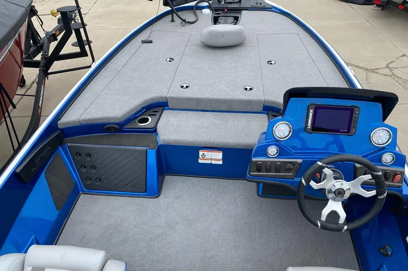 Slide: The Image of 2024 Nitro Z18 Pro boat interior with steering wheel and dashboard controls. - 2