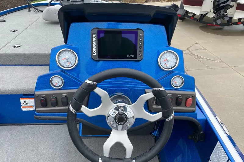 Slide: The Image of 2024 Nitro Z18 Pro boat dashboard with steering wheel and Lowrance display. - 3