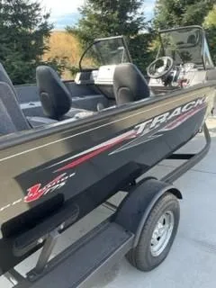 Slide: The Image of 2025 Tracker Pro Guide V-175 WT boat on trailer, sleek design, outdoor setting. - 3