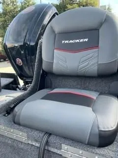 Slide: The Image of 2025 Tracker Pro Guide V-175 WT boat seat with sleek design and branding. - 8