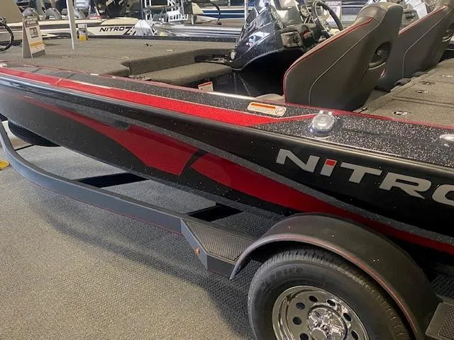 Slide: The Image of 2024 Nitro Z19 boat with sleek black and red design on display. - 7
