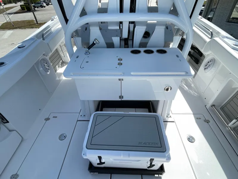 Slide: The Image of 2025 Blackfin 302CC boat interior with seating and storage compartments. - 11