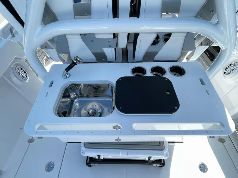 Slide: The Image of 2025 Blackfin 302CC boat console with sink and cup holders. - 12