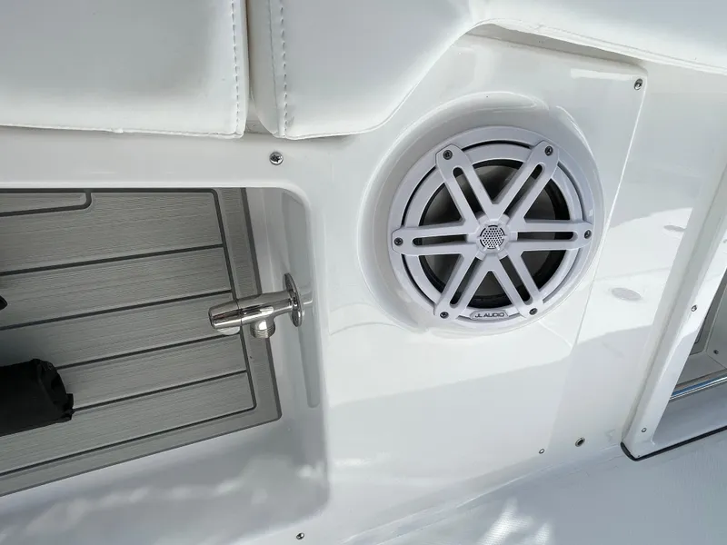 Slide: The Image of Speaker and latch detail on 2025 Blackfin 302CC boat interior. - 19