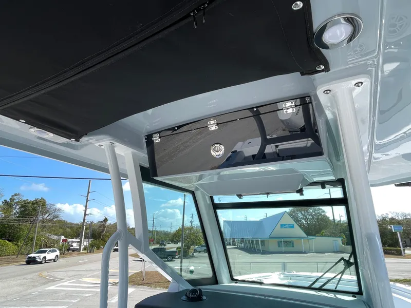 Slide: The Image of 2025 Blackfin 302CC boat interior, featuring overhead storage and sleek design elements. - 20