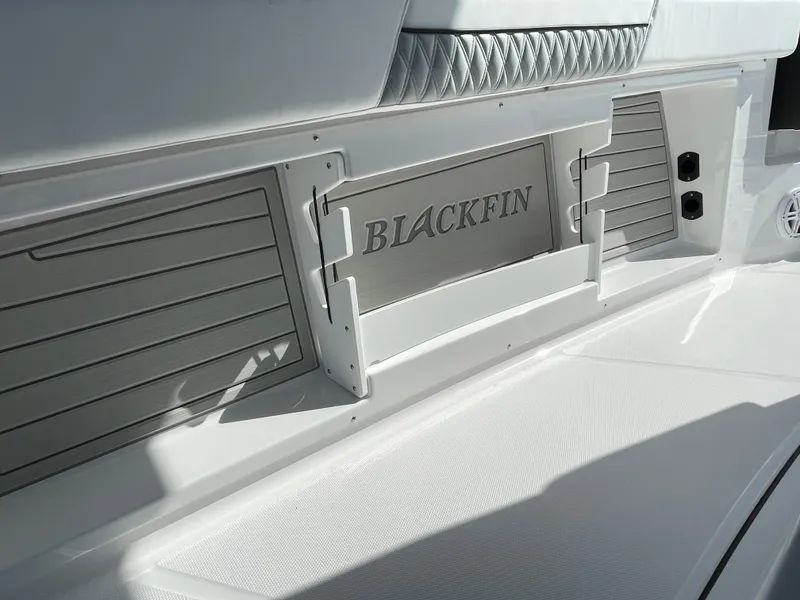 Slide: The Image of 2025 Blackfin 302CC boat interior with sleek design and storage compartments. - 22