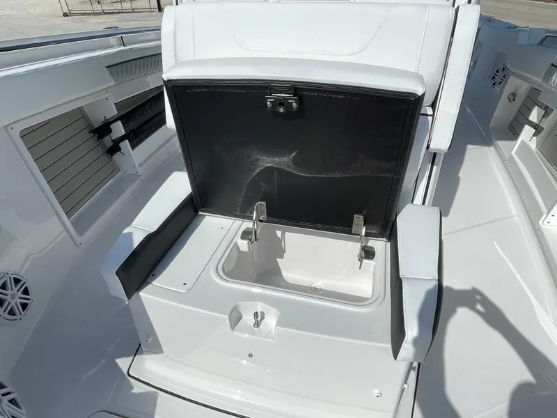 Slide: The Image of 2025 Blackfin 302CC boat interior with open storage compartment, showcasing sleek design and functionality. - 28