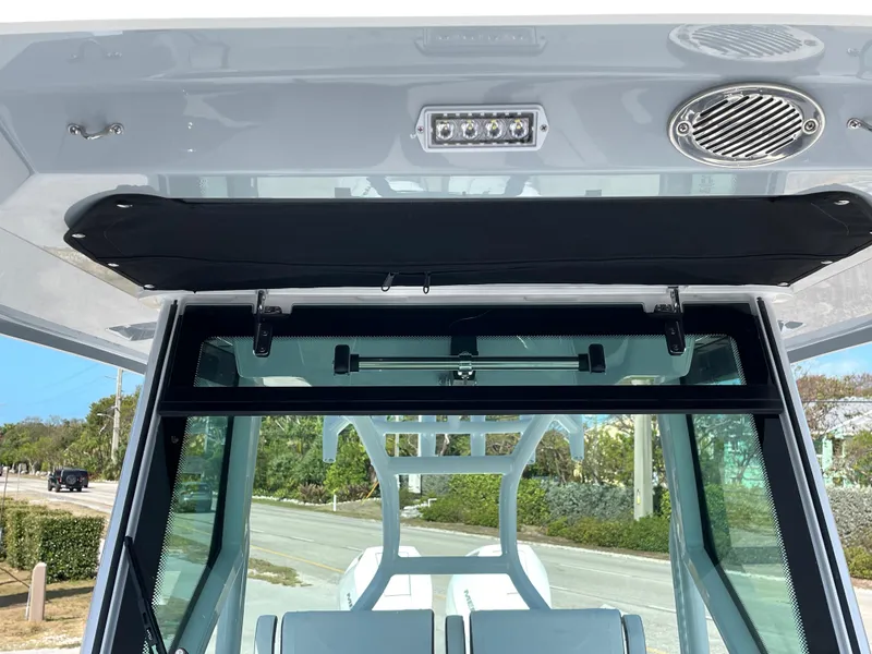 Slide: The Image of 2025 Blackfin 302CC boat interior with modern console and speaker system. - 33