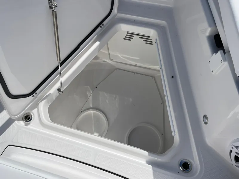 Slide: The Image of Open storage compartment on 2025 Blackfin 302CC boat, showcasing spacious interior design. - 35