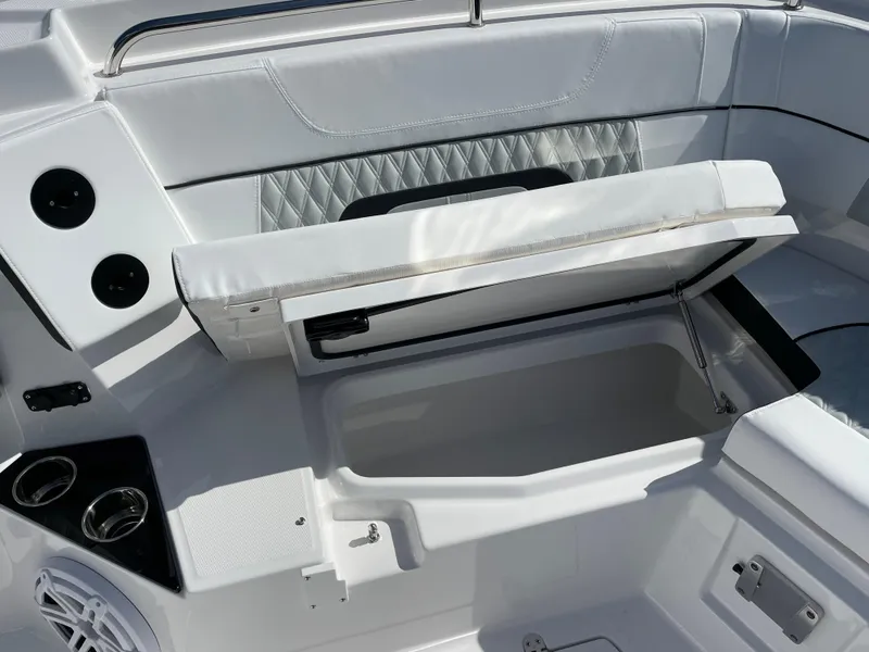 Slide: The Image of 2025 Blackfin 302CC boat interior with open storage compartment and cushioned seating. - 36