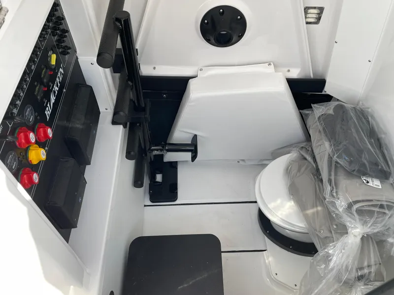 Slide: The Image of 2025 Blackfin 302CC boat interior with control panel and seating area. - 37