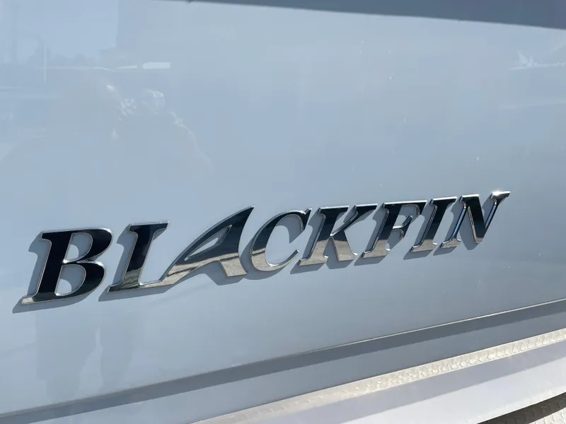 Slide: The Image of Blackfin 302CC 2025 model logo on boat exterior. - 5