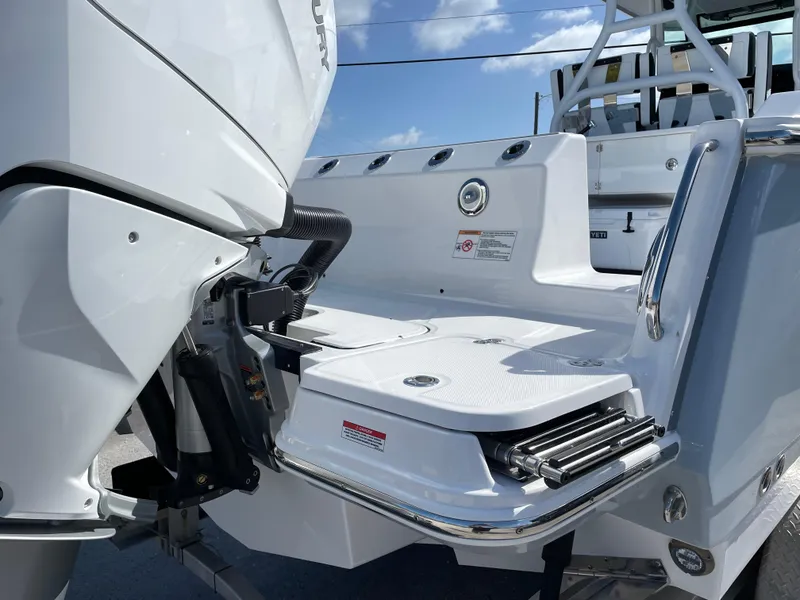 Slide: The Image of 2025 Blackfin 302CC boat stern with engine and swim platform. - 7