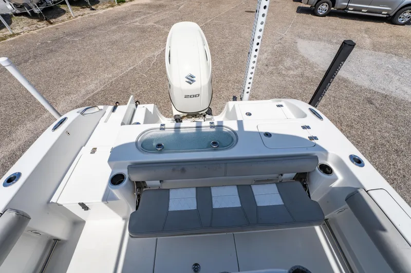 Slide: The Image of 2019 Sea Pro 219 DLX boat with Suzuki 200 engine, rear seating, and livewell. - 12