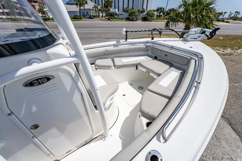 Slide: The Image of 2019 Sea Pro 219 DLX boat interior with cushioned seating and sleek design. - 20