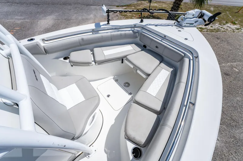 Slide: The Image of 2019 Sea Pro 219 DLX boat interior with cushioned seating and modern design. - 21
