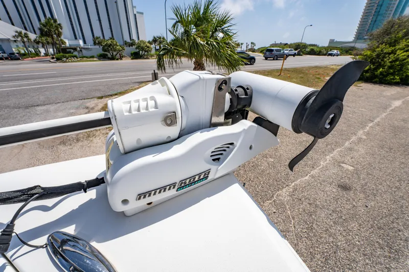 Slide: The Image of 2019 Sea Pro 219 DLX boat with Minn Kota trolling motor on a sunny day. - 23