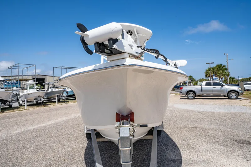Slide: The Image of 2019 Sea Pro 219 DLX boat on trailer, front view, clear sky background. - 8