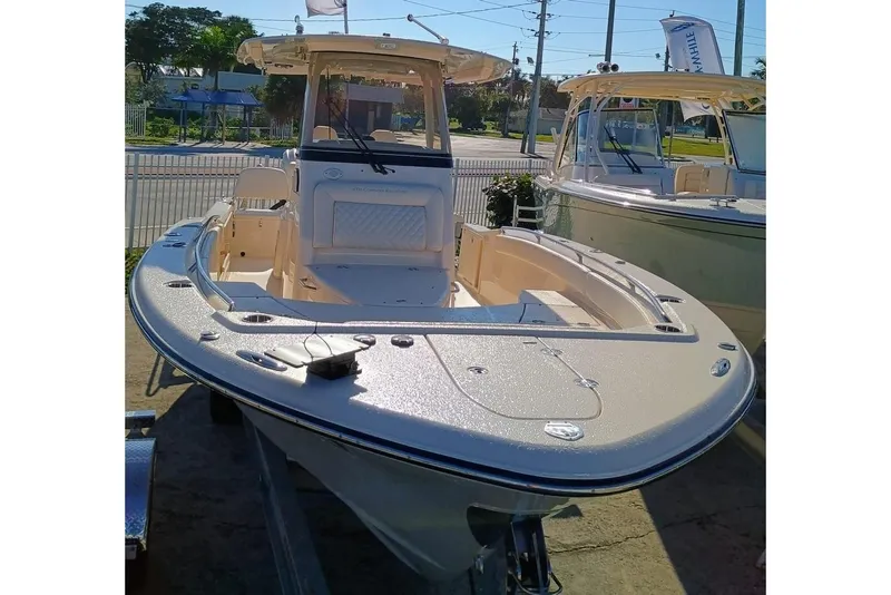 Slide: The Image of 2025 Grady-White 281 Coastal Explorer boat, docked, showcasing sleek design and spacious deck. - 2