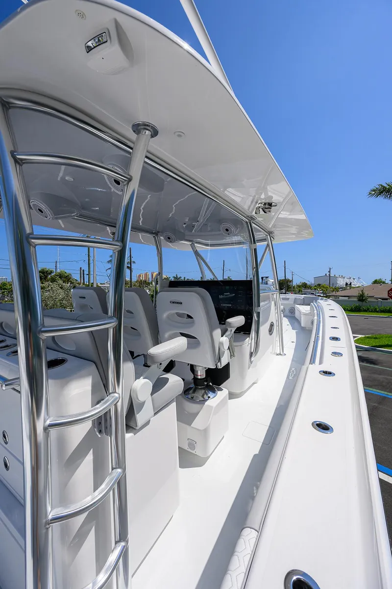 Slide: The Image of 2025 Contender 44ST boat interior with sleek seating and modern design. - 13