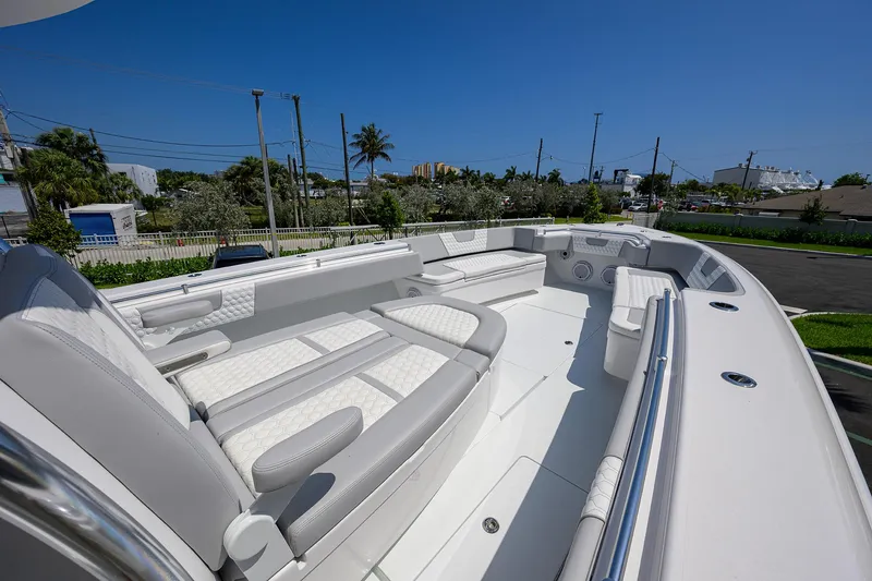 Slide: The Image of 2025 Contender 44ST boat with spacious seating and sleek design. - 14